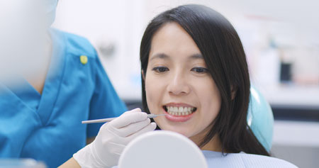 patient with her teeth