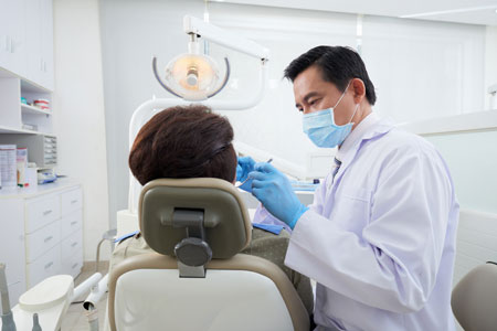 patient with a dental surgeon