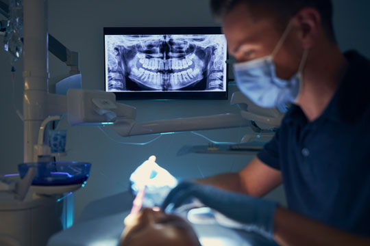 dentist and x ray of teeth